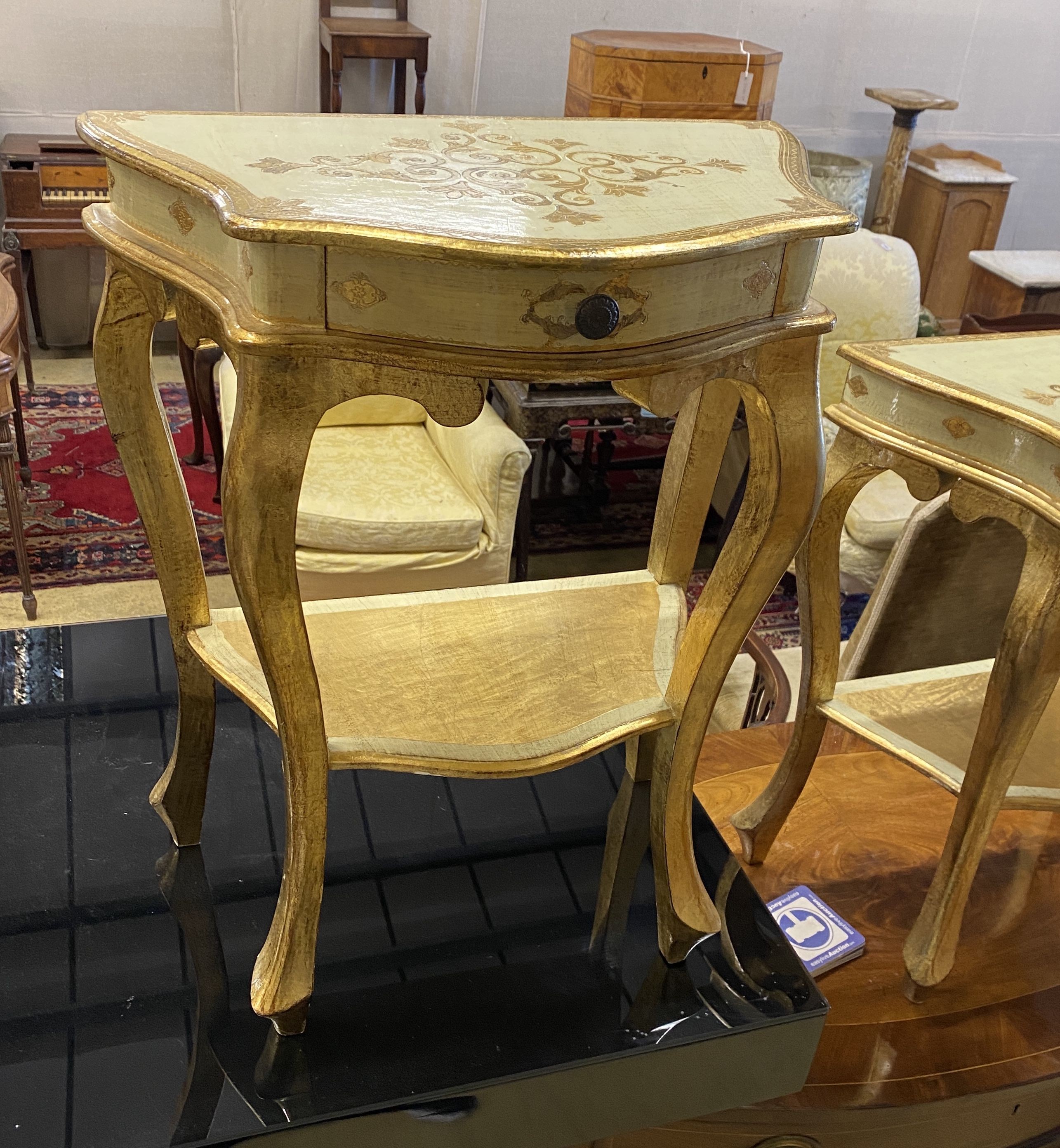 Three Italian gold painted parcel gilt serpentine bedside tables, largest 152cm, depth 32cm, height 63cm